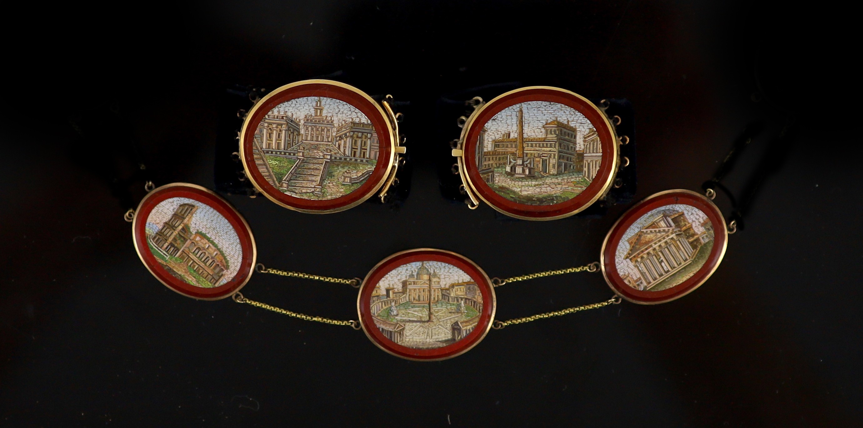 A 19th century Italian Grand Tour Souvenir gold mounted micro mosaic plaque necklace and a pair of matching bracelets Plaques 2cm-3cm., overall 42.5cm.